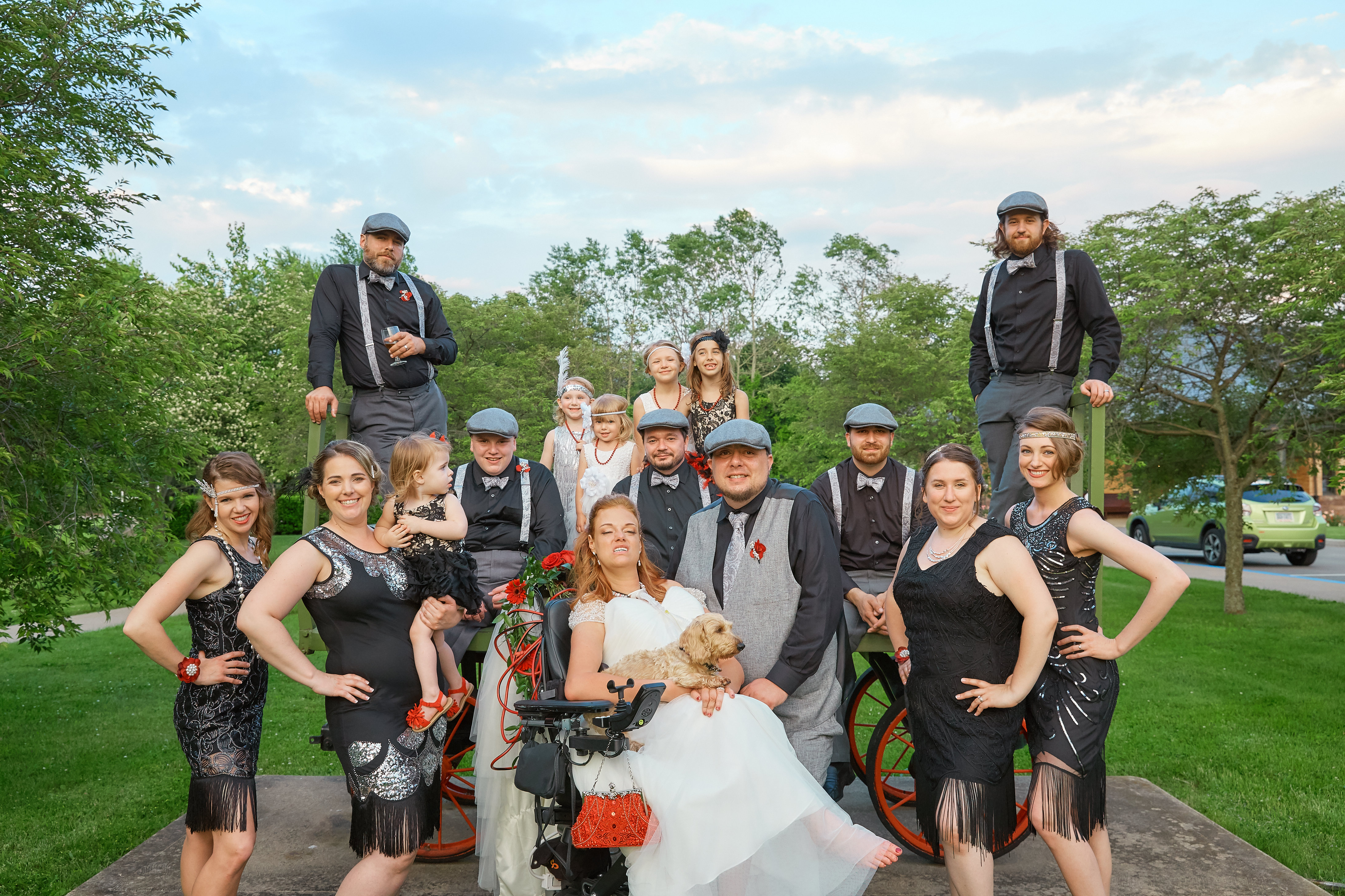 Josie Badger, one of her dogs, her husband, Mike, and their wedding party